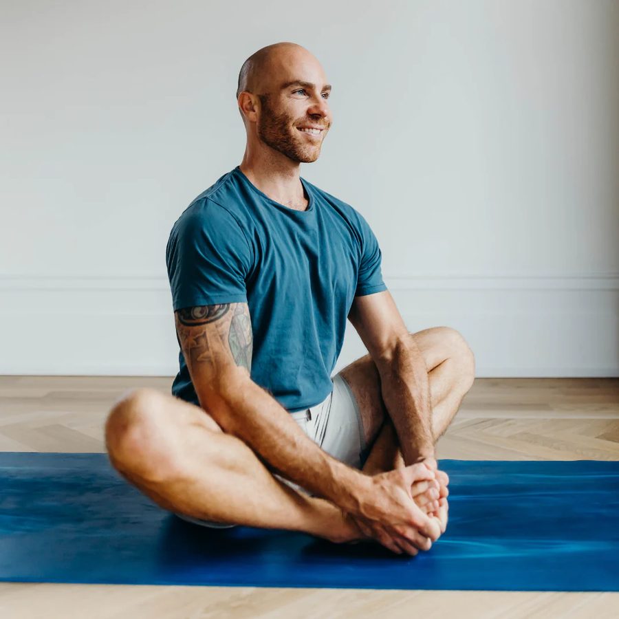 Seated in a calm, upright posture